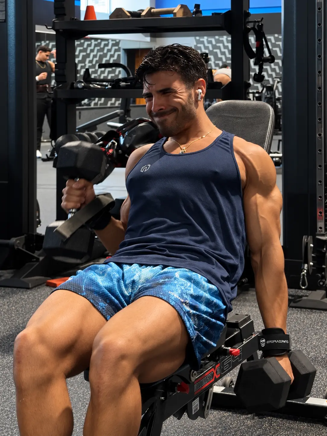 Dylan training with dumbbells in the gym